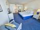 Comfortable bedroom features blue carpet, queen bed, and bathroom access for a relaxing retreat at 9820 Queensway Blvd. # 501, Myrtle Beach, SC 29572