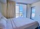 Serene bedroom with balcony access offering ocean views, perfect for relaxation and enjoyment at 9820 Queensway Blvd. # 501, Myrtle Beach, SC 29572