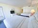 Bright bedroom with two beds, balcony access, and charming decor for a relaxing coastal getaway at 9820 Queensway Blvd. # 501, Myrtle Beach, SC 29572