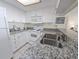 Clean, well-maintained kitchen with white appliances and granite countertops at 9820 Queensway Blvd. # 501, Myrtle Beach, SC 29572