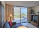 Living room with ocean view from balcony and entertainment center at 9820 Queensway Blvd. # 501, Myrtle Beach, SC 29572