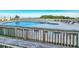 Outdoor pool with lounge chairs and umbrellas overlooking the ocean and beach at 9820 Queensway Blvd. # 501, Myrtle Beach, SC 29572