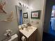 Neutral bathroom with a decorative mirror, neutral walls and fixtures at 220 Landing Rd. # I, North Myrtle Beach, SC 29582