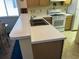 Kitchen with breakfast bar and double stainless steel sink at 220 Landing Rd. # I, North Myrtle Beach, SC 29582