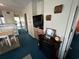 Cozy living room area featuring a flatscreen television, decorative fireplace, and stylish decor at 220 Landing Rd. # I, North Myrtle Beach, SC 29582