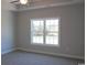 Spacious bedroom with carpet flooring and large window at 2347 King Farm Rd., Aynor, SC 29511