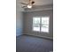 Spacious bedroom with carpet flooring and large window at 2347 King Farm Rd., Aynor, SC 29511