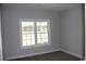 Bedroom with carpet flooring and large window at 2347 King Farm Rd., Aynor, SC 29511