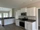 White cabinets and granite countertops in the kitchen at 2347 King Farm Rd., Aynor, SC 29511