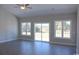 Spacious living room with large windows and sliding glass doors at 2347 King Farm Rd., Aynor, SC 29511