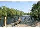 Relaxing riverfront deck with wooden benches overlooking tranquil waters at 2347 King Farm Rd., Aynor, SC 29511