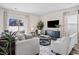 Bright living room featuring neutral walls, hardwood floors, a patterned rug, and plenty of natural light at 3035 Deerberry Place, Longs, SC 29568
