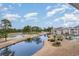 Beautiful aerial view featuring a condo complex overlooking a pond, golf course and swimming pool at 4733 Wild Iris Dr. # 302, Myrtle Beach, SC 29577
