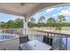 Relaxing balcony with a ceiling fan, overlooking the lush green golf course and serene pond at 4733 Wild Iris Dr. # 302, Myrtle Beach, SC 29577