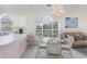 Bright dining area boasts a glass table, wicker chairs, and great natural light at 4733 Wild Iris Dr. # 302, Myrtle Beach, SC 29577