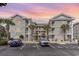 Stunning condo exterior with brick facade, beautiful balconies, and convenient parking at 4733 Wild Iris Dr. # 302, Myrtle Beach, SC 29577