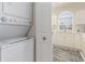 Conveniently located laundry area near the kitchen, featuring a stacked washer and dryer at 4733 Wild Iris Dr. # 302, Myrtle Beach, SC 29577
