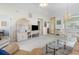 Inviting living room with neutral tones, a ceiling fan, and seamless flow into the dining area at 4733 Wild Iris Dr. # 302, Myrtle Beach, SC 29577