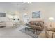 Cozy living room open to the dining area, featuring comfortable seating and stylish decor at 4733 Wild Iris Dr. # 302, Myrtle Beach, SC 29577