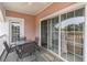 Enjoy this patio with outdoor seating and sliding glass doors offering views of the lush landscaping at 4733 Wild Iris Dr. # 302, Myrtle Beach, SC 29577