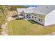 Large backyard with well-maintained lawn and patio offering a view of the surrounding landscape at 397 Sun Colony Blvd., Longs, SC 29568