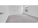 Bright bedroom featuring plush carpet, window, and closet space at 397 Sun Colony Blvd., Longs, SC 29568