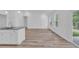 Living room featuring wood floors, and a kitchen breakfast bar at 397 Sun Colony Blvd., Longs, SC 29568