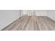 Open living space with wood-look floors and white base trim at 397 Sun Colony Blvd., Longs, SC 29568