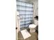 Bathroom with a white and blue striped shower curtain at 9550 Shore Dr. # 925, Myrtle Beach, SC 29572
