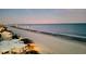Aerial view of the beach at dusk at 9550 Shore Dr. # 925, Myrtle Beach, SC 29572