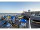 Expansive beach view with tables and umbrellas, providing a relaxing coastal atmosphere at 9550 Shore Dr. # 925, Myrtle Beach, SC 29572