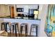 View of kitchen island featuring a breakfast bar and white cabinets and modern appliances at 9550 Shore Dr. # 925, Myrtle Beach, SC 29572
