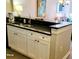 Kitchen sink with black granite countertops and white cabinets at 9550 Shore Dr. # 925, Myrtle Beach, SC 29572