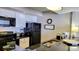Modern kitchen with sleek black appliances, white cabinetry, and granite countertops at 9550 Shore Dr. # 925, Myrtle Beach, SC 29572