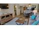 Open concept living area with stylish furniture, including a sofa, table, and entertainment center at 9550 Shore Dr. # 925, Myrtle Beach, SC 29572