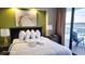 Well-appointed bedroom featuring a large bed, stylish decor, and balcony access, providing a serene retreat at 9550 Shore Dr. # 925, Myrtle Beach, SC 29572