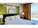 Bright bedroom with a king bed, balcony access, and view, offering a comfortable and relaxing atmosphere at 9550 Shore Dr. # 925, Myrtle Beach, SC 29572