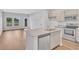 Open kitchen featuring granite countertops, stainless steel appliances, and wood floors at 439 Waterend Dr. # 8, Little River, SC 29566