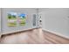 Bright living room with backyard view, wood floors, and natural light at 439 Waterend Dr. # 8, Little River, SC 29566