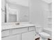 This bathroom has a toilet, sink, vanity, mirror, shower, and towel rack at 233 Sandridgebury Dr. # 57, Little River, SC 29566