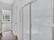 Bathroom showcasing a modern, glass-enclosed shower and white interior at 233 Sandridgebury Dr. # 57, Little River, SC 29566