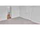 Bedroom with carpeted floors and a view into an attached bathroom at 233 Sandridgebury Dr. # 57, Little River, SC 29566