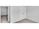 Bedroom showcasing double-door closet and adjacent room entrance at 233 Sandridgebury Dr. # 57, Little River, SC 29566