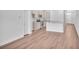 A well-lit kitchen showcases hardwood flooring, stainless steel appliances, and an island at 233 Sandridgebury Dr. # 57, Little River, SC 29566