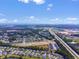 Expansive aerial shot of a community with a highway and distant ocean view at 293 Sandridgebury Dr. # 66, Little River, SC 29566
