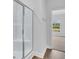 Modern bathroom with glass-enclosed shower and view of the outdoors at 293 Sandridgebury Dr. # 66, Little River, SC 29566