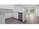 Modern kitchen boasts gray counters, stainless appliances, and an open layout at 293 Sandridgebury Dr. # 66, Little River, SC 29566