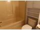 Clean bathroom featuring a bathtub, toilet, and shelving at 1230 St. George Ln. # B, Myrtle Beach, SC 29588