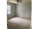 Carpeted bedroom with neutral walls and a window at 1230 St. George Ln. # B, Myrtle Beach, SC 29588