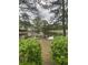 Serene pond view with lush landscaping and residential buildings at 1230 St. George Ln. # B, Myrtle Beach, SC 29588